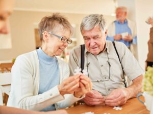 Older adult looking thoughtful with brain health icons — representing Alzheimer’s & dementia awareness