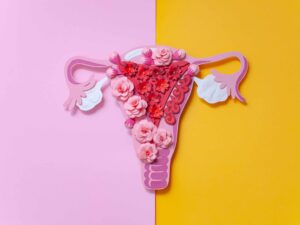 Woman holding her lower abdomen in pain, symbolizing endometriosis and chronic pelvic discomfort