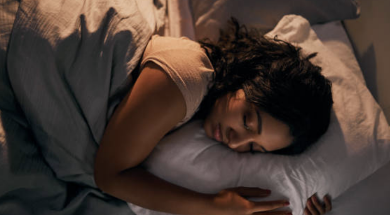 Peaceful woman sleeping, symbolizing VITACED CALMNIGHT® natural sleep aid – Cedem AG