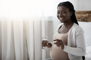 Healthy pregnancy and maternal care concept with expectant mother
